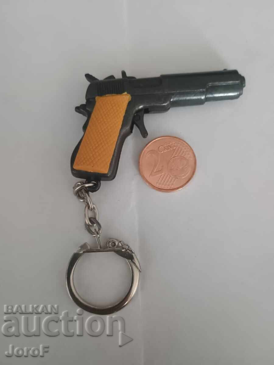 Breloc mic în formă de pistol din anii '90 Breloc mic în formă de pistol din anii '90