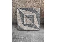 Decorative mosaic panel in a metal frame, natural material