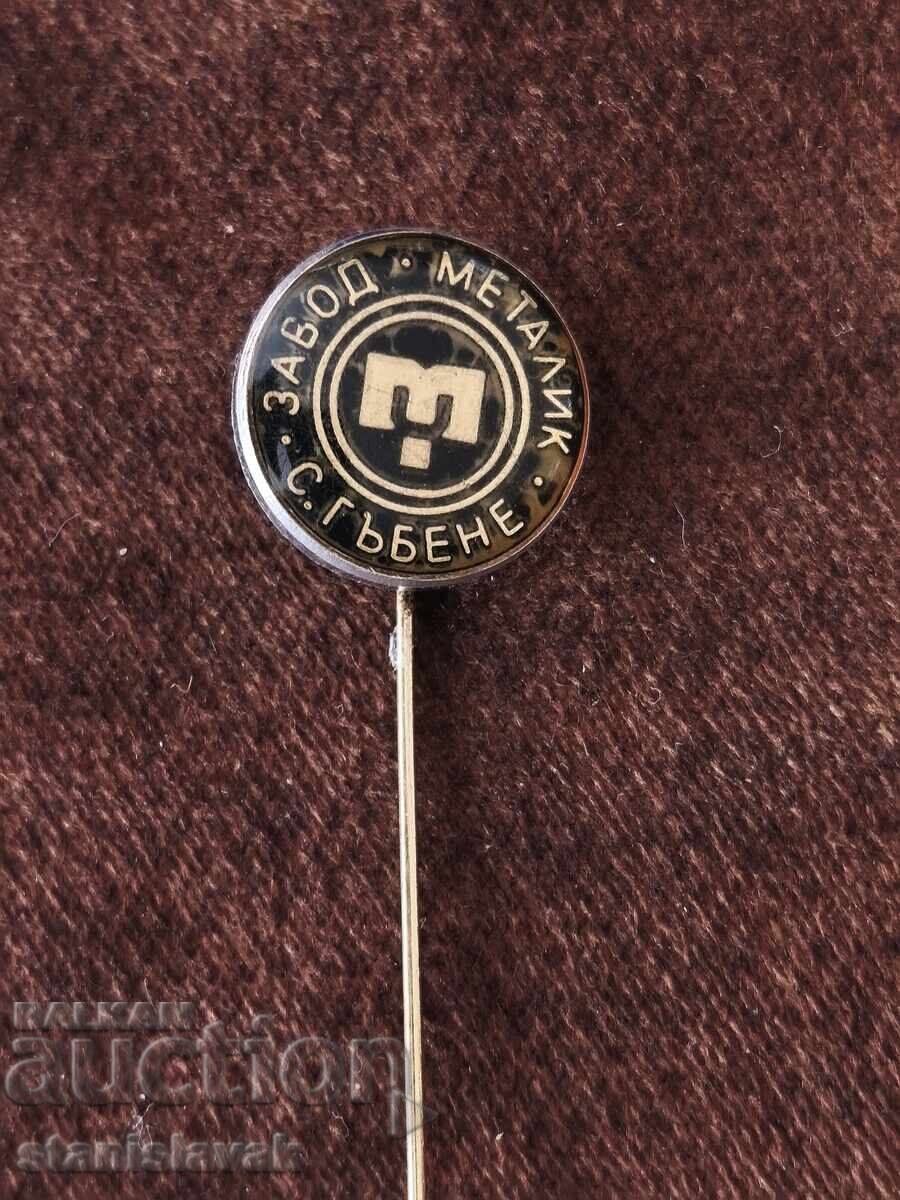 Metalik factory badge, Gabene village