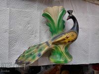 old peacock-shaped vase