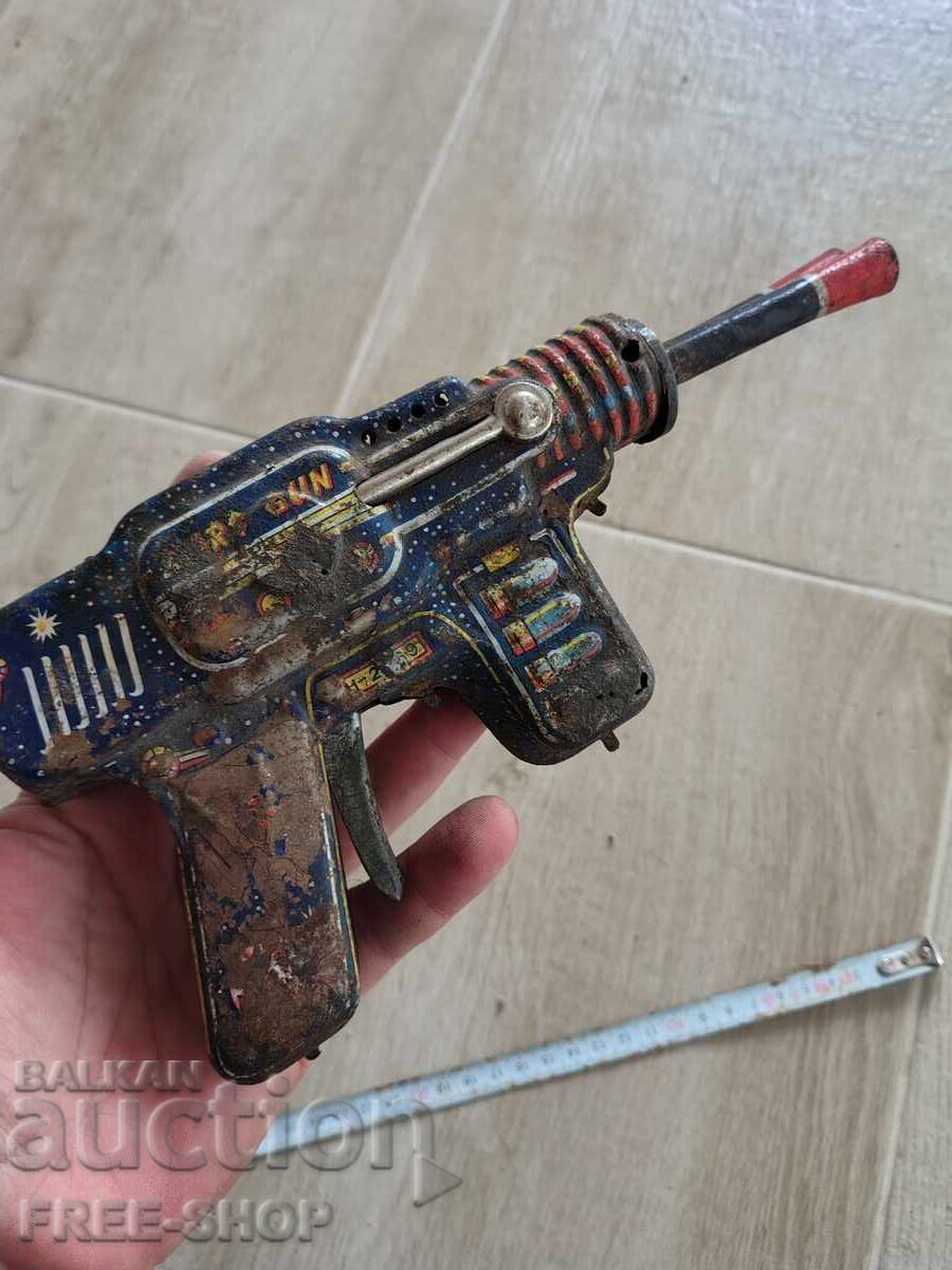 Auction  An old tin toy