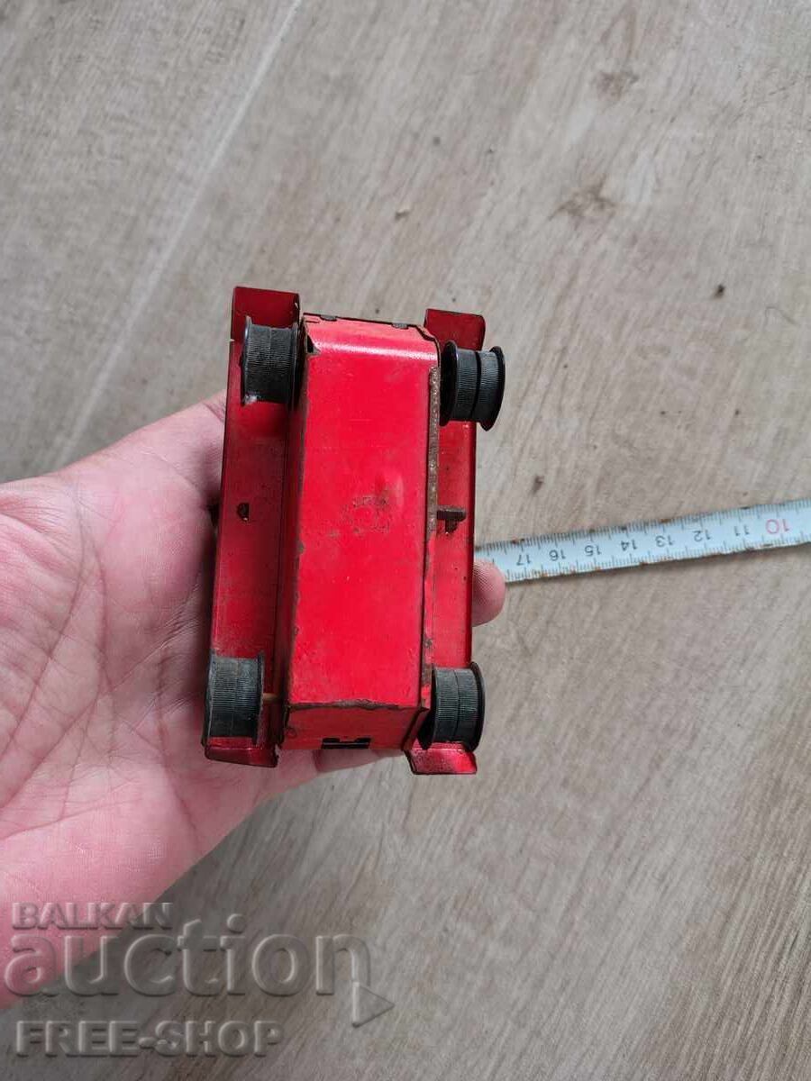 Auction  An old tin toy
