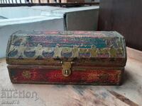 Old wooden box with brass fittings and ornaments