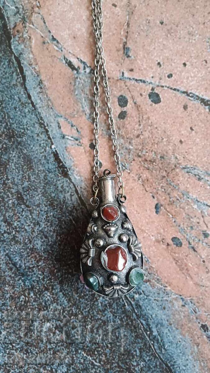 Antique necklace is a perfume bottle