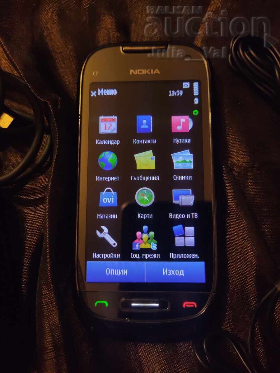 Auction  Nokia C7 in excellent condition starting bid from 0.01 cents
