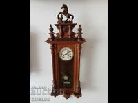 Antique German wall clock with decorative horse sculpture