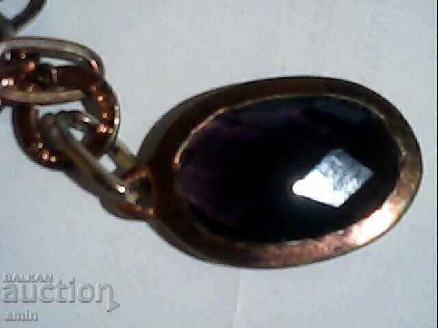 Old silver pendant with a large amethyst stone