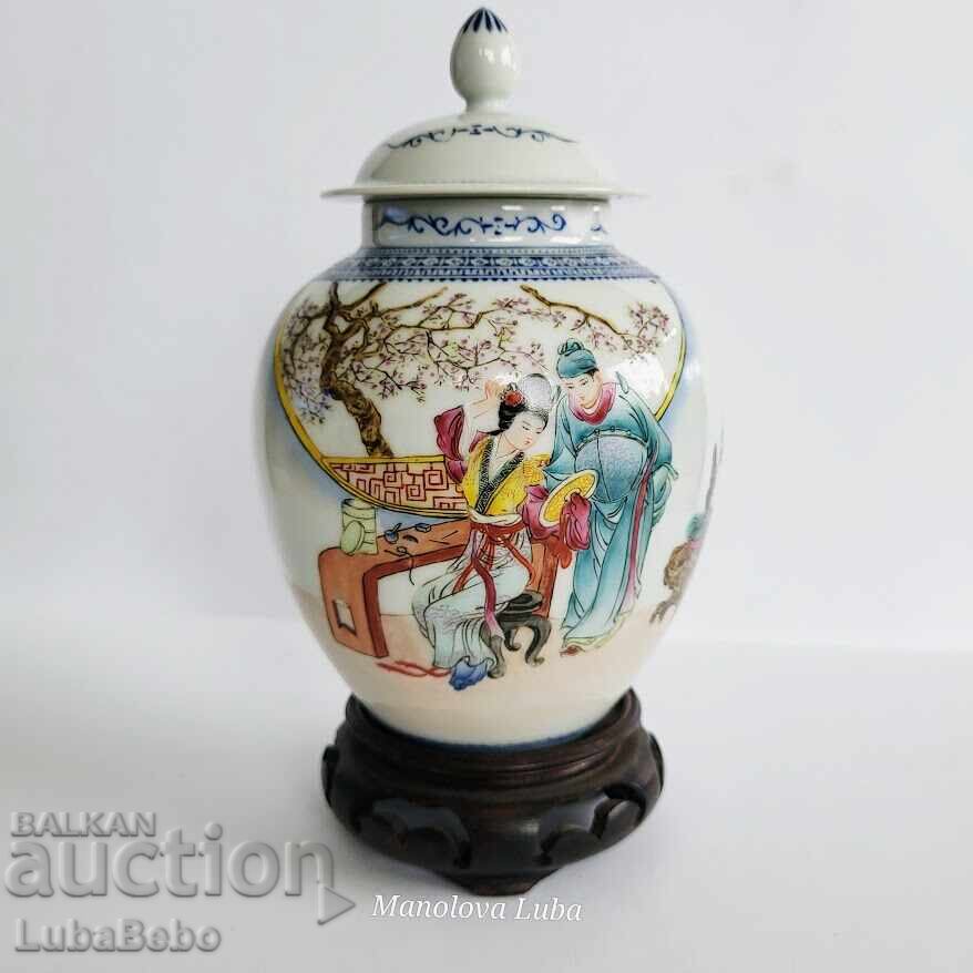 Chinese ginger jar on a wooden stand