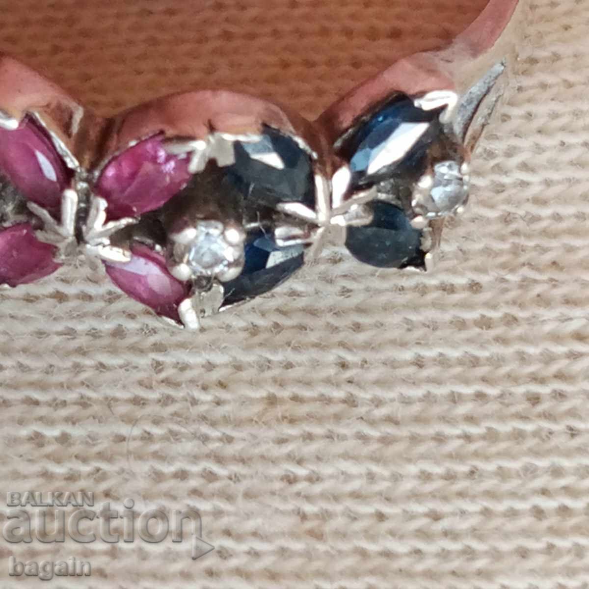 Auction  Ring with emeralds, rubies, and sapphires. Silver