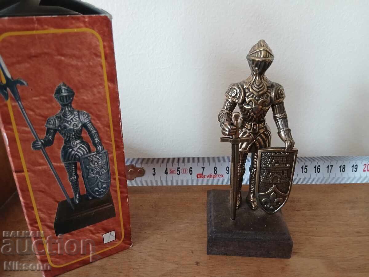 yellow metal knight figurine