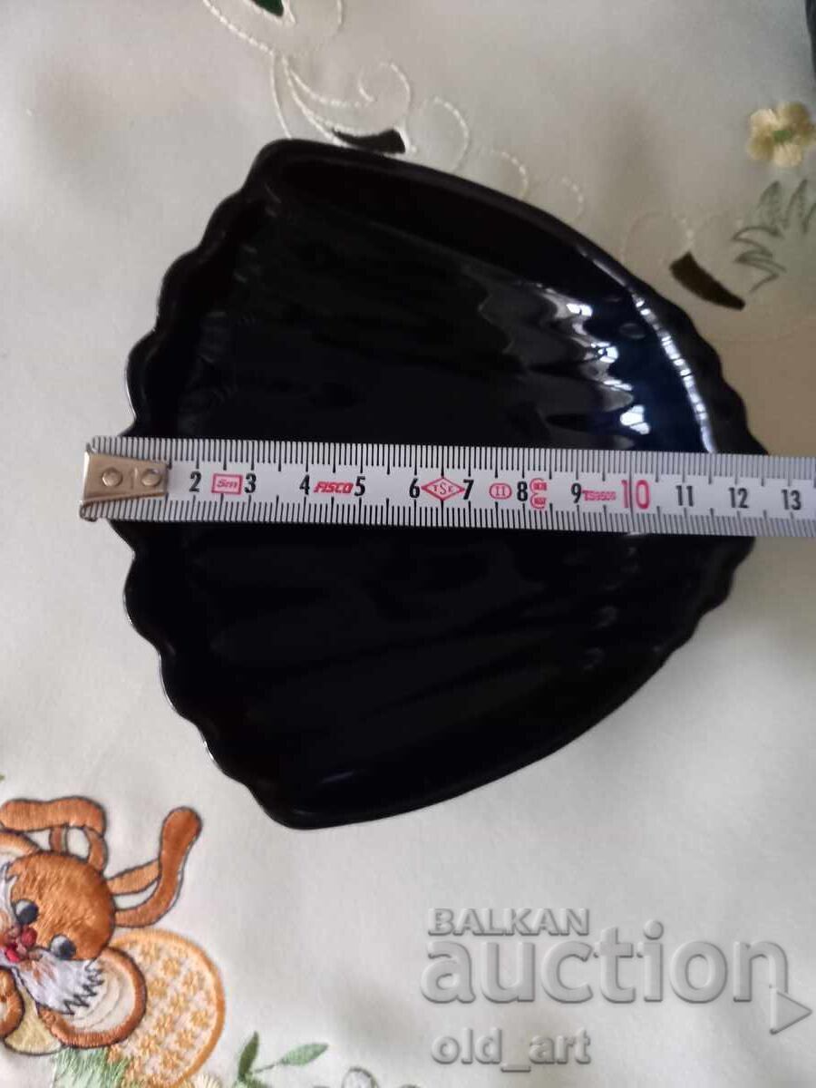Auction Tempered black glass shell-shaped platter Auction Tempered black glass shell-shaped platter
