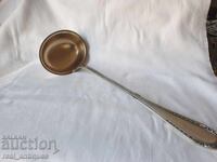 Silver-plated ladle with gilding