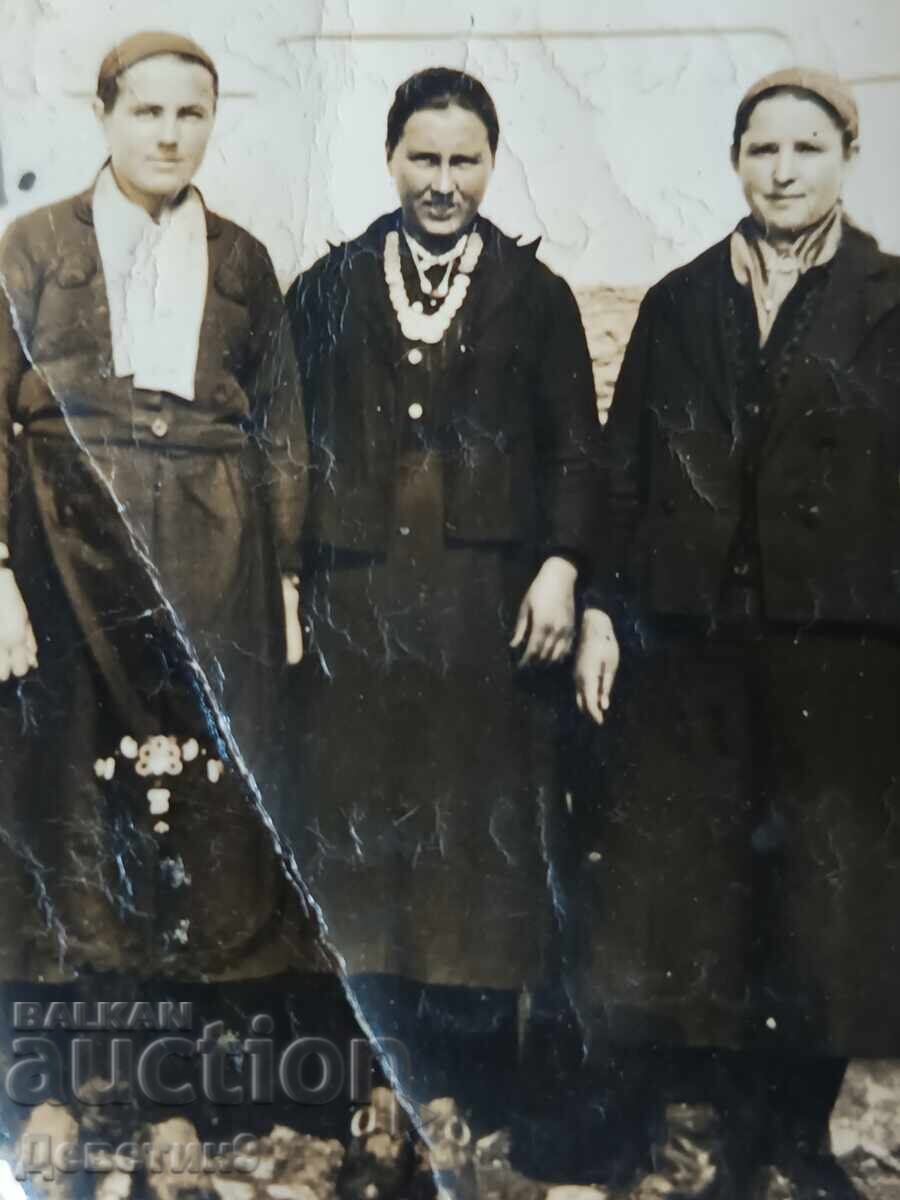 Auction  Portrait of three village women