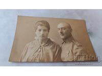 Photograph Officer from the 36th Infantry Regiment with a Cross for Bravery and a woman 1918