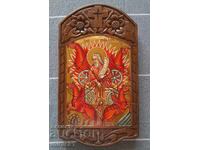 Hand-painted icon in a wood-carved frame