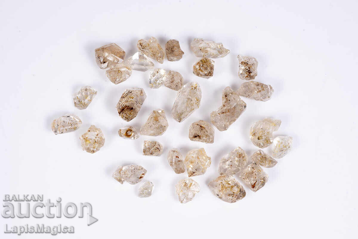 Παρτίδα 32 τεμ. κρύσταλλοι χαλαζία με εγκλείσματα πετρελαίου 55.6ct φθορίζοντες