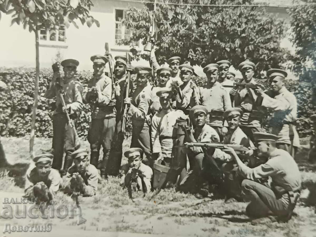 Auction  Armed soldiers in front of a military unit