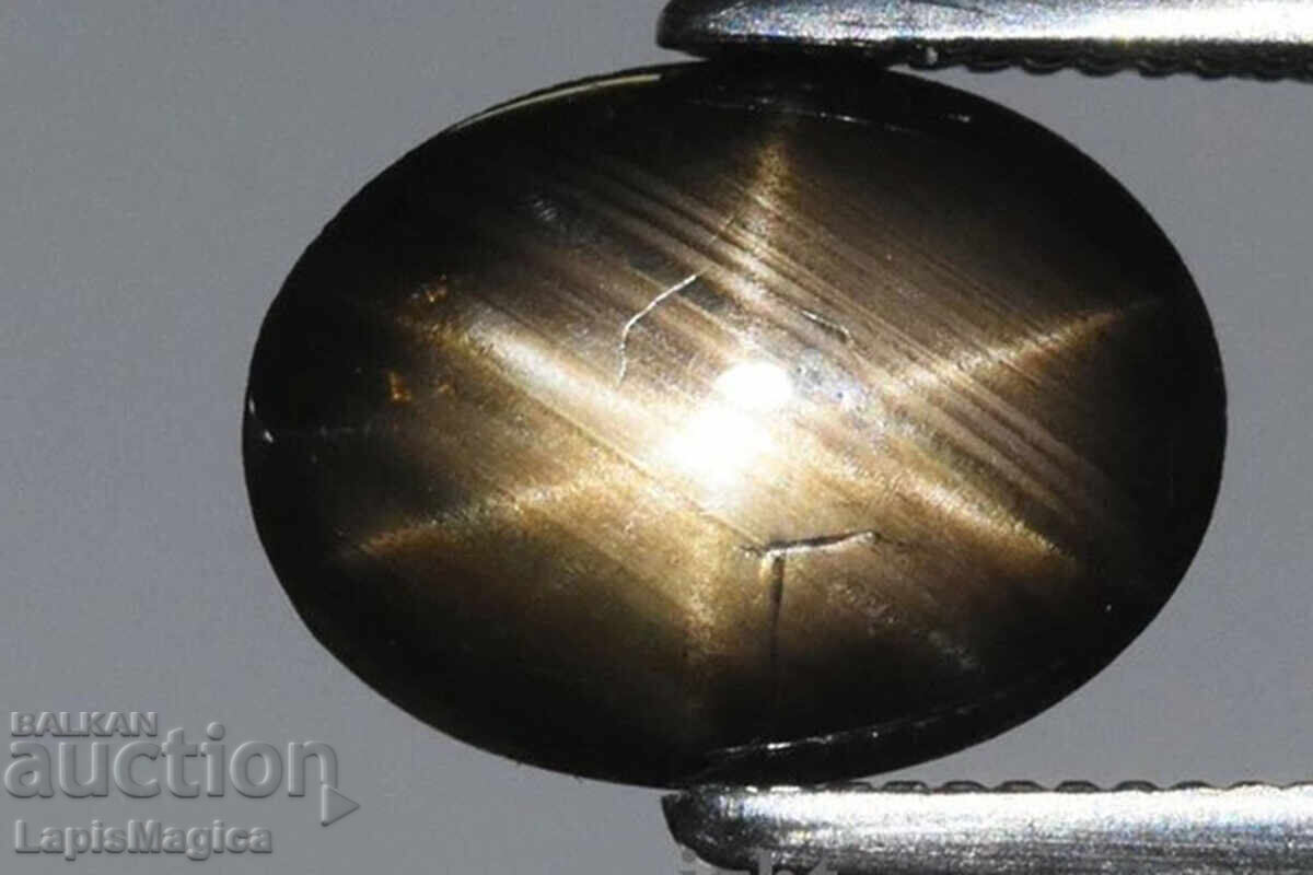 Safir stelat negru cu 6 raze 1.40ct netratat caboșon oval