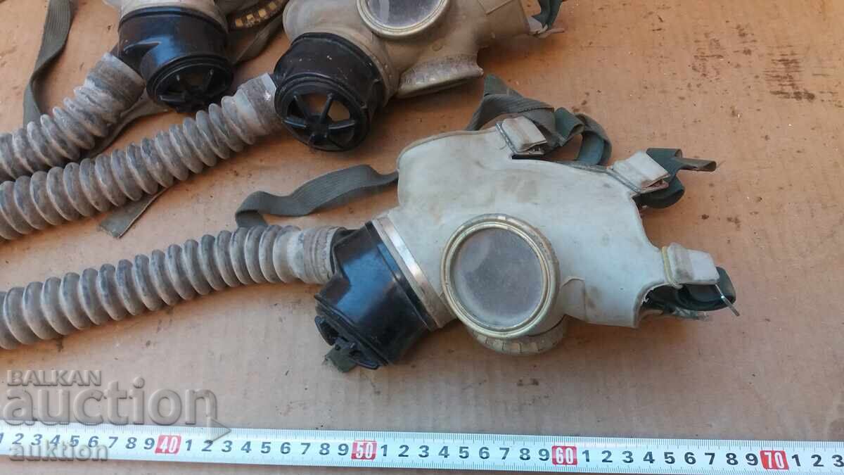 Auction  LOT OF THREE GAS MASKS WITH HOSES