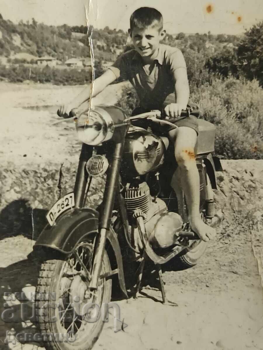 Auction Child with a motorcycle outdoors - 1960 (Veliko Tarnovo region) Auction Child with a motorcycle outdoors - 1960 (Veliko Tarnovo region)