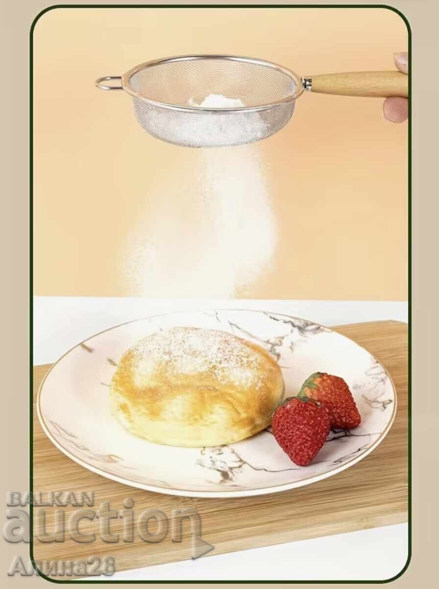 Auction  Strainer with a wooden handle