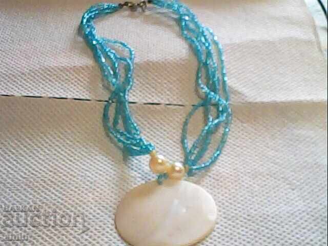 Beautiful necklace made of mother-of-pearl and beads