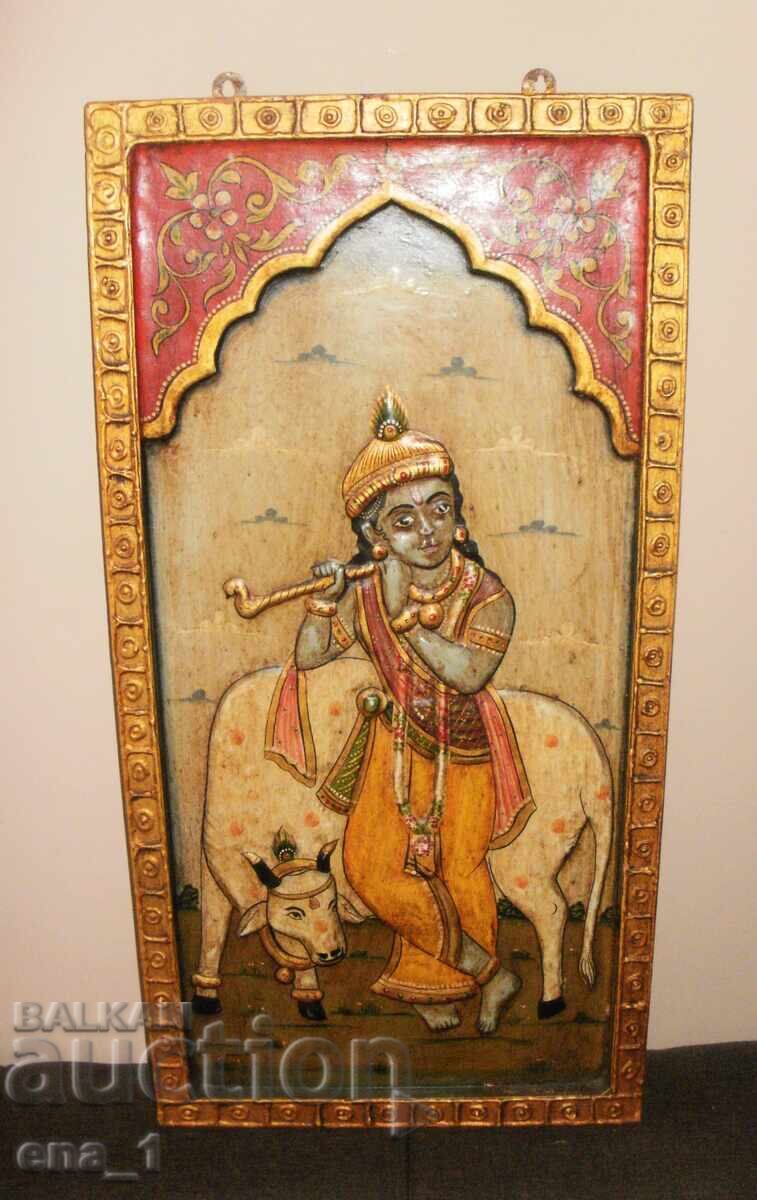 Decorațiune de perete indiană veche, reprezentându-l pe Krishna cu o vacă Decorațiune de perete indiană veche, reprezentându-l pe Krishna cu o vacă