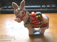 Children's toy - donkey with vegetables in saddlebags