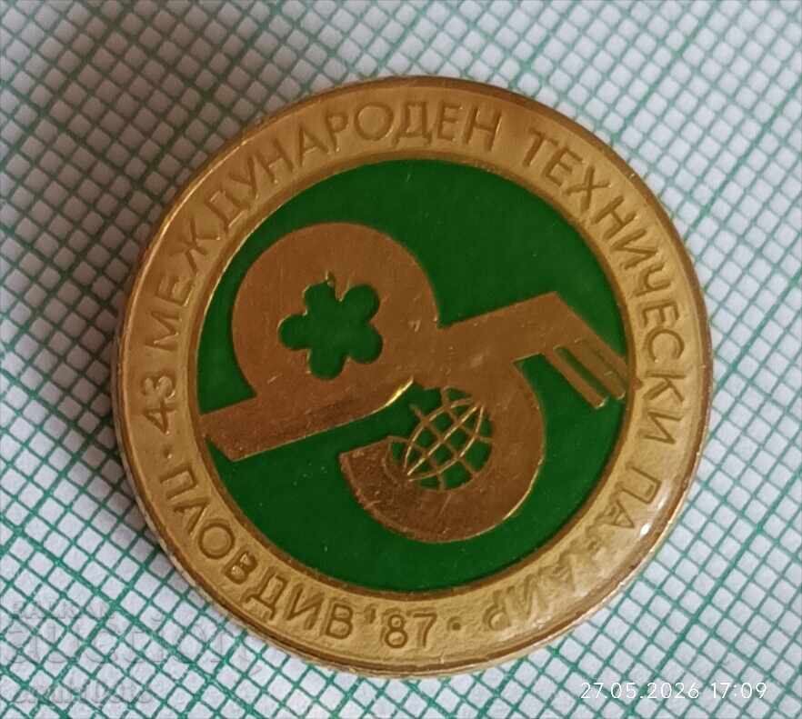 Insignă - Târgul Tehnic Internațional Plovdiv 87 cu preț € 1.00 | 1.96 BGN