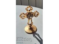 Jewelry metal bronze cross with a crystal in the middle