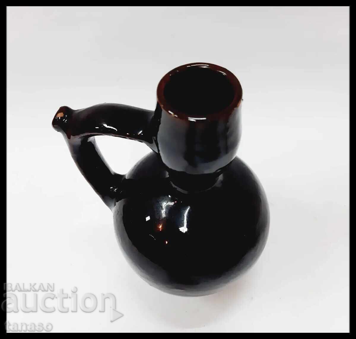 Auction  Vintage Trojan ceramic pitcher with dark brown glaze
