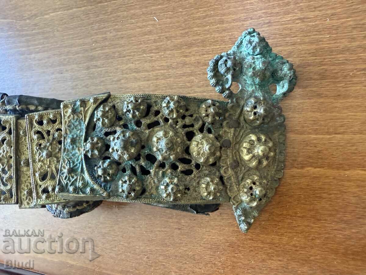 Old bronze belt about 75 centimeters long