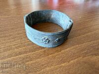 Old bronze bracelet with flowers