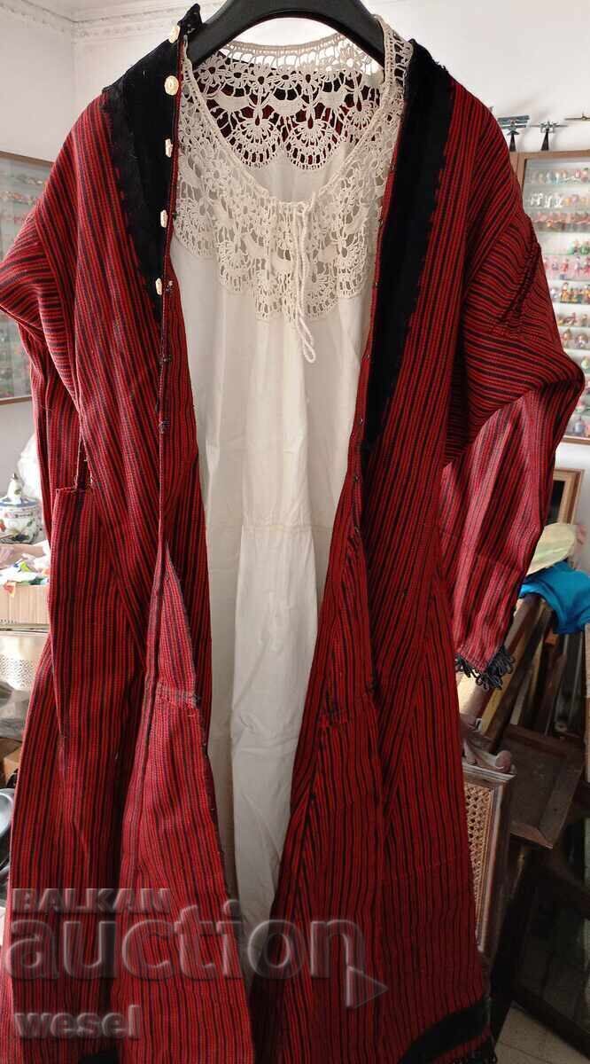 Two parts of an old traditional female folk costume Two parts of an old traditional female folk costume