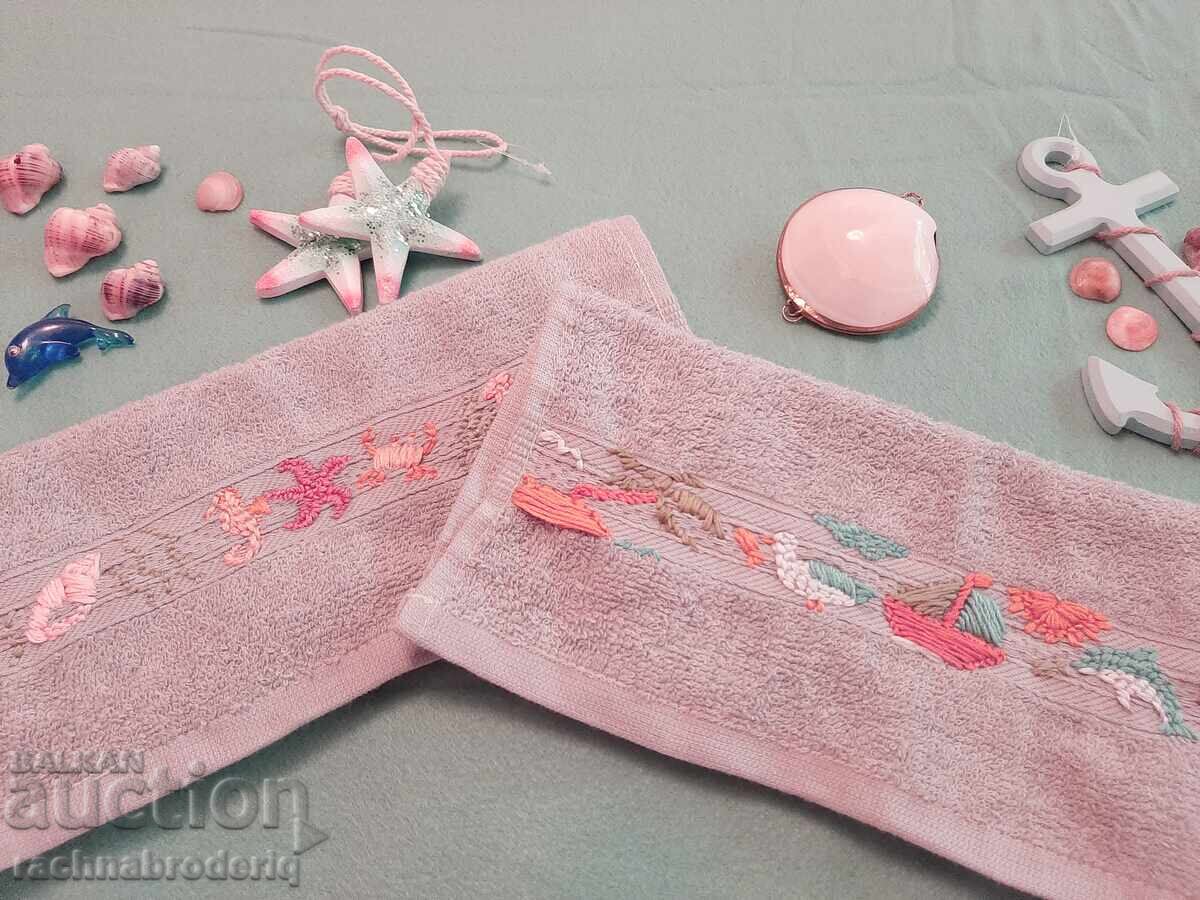 Hand-embroidered towels with nautical motifs Hand-embroidered towels with nautical motifs