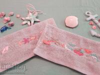 Hand-embroidered towels with nautical motifs