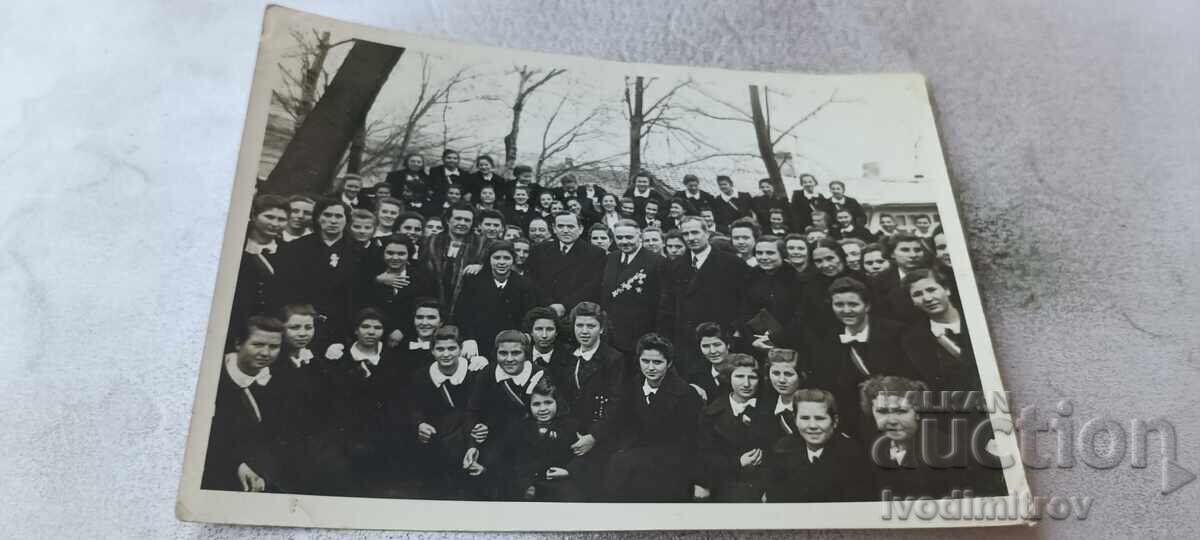 Photo: Students with teachers and a man with orders and medals Photo: Students with teachers and a man with orders and medals