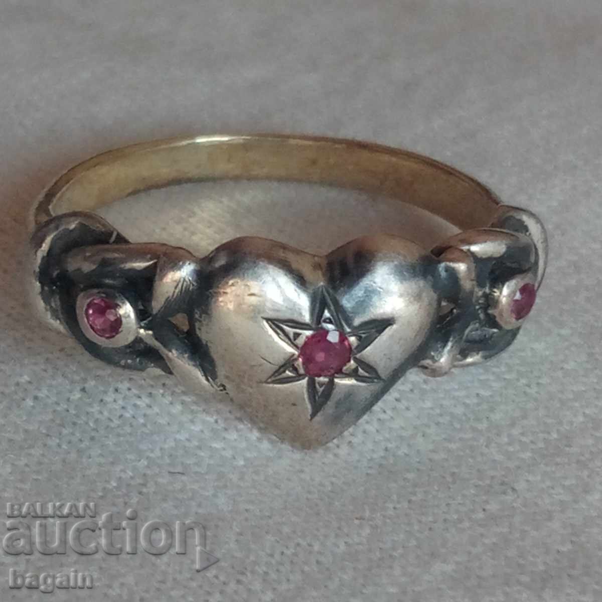 Unique silver ring with rubies and gold plating