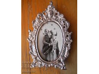Madonna and Child in a richly decorated frame