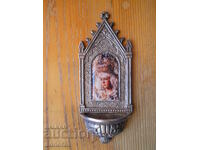 Holy water container with an image of the Virgin Macarena