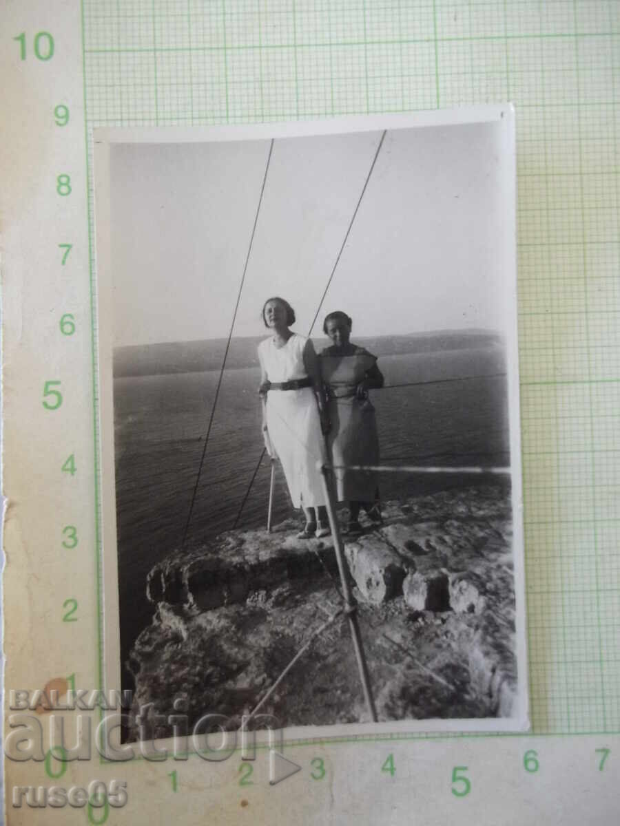 Photo of two women on the rocky shore old