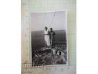 Photo of two women on the rocky shore old