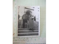 Photo of a uniformed man with a disabled veteran on the steps, old - 1