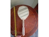 Art Deco handheld vanity mirror, silver-plated metal frame