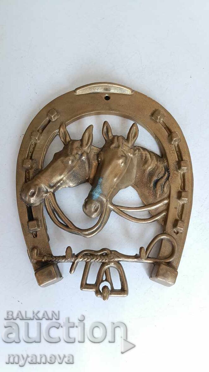 Delivery of Vintage, bronze, wall-mounted horseshoe with horses