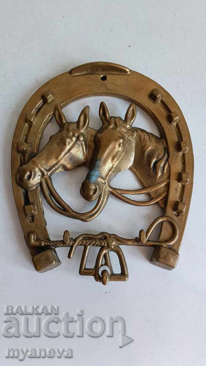 Vintage, bronze, wall-mounted horseshoe with horses