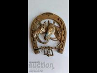 Vintage, bronze, wall-mounted horseshoe with horses