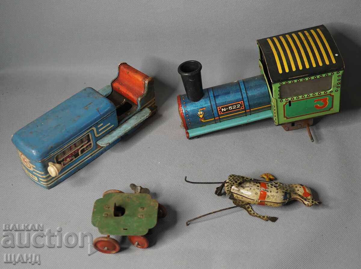 Licitație Lot jucării mecanice vechi din metal tractor, cilindru compactor, zebră