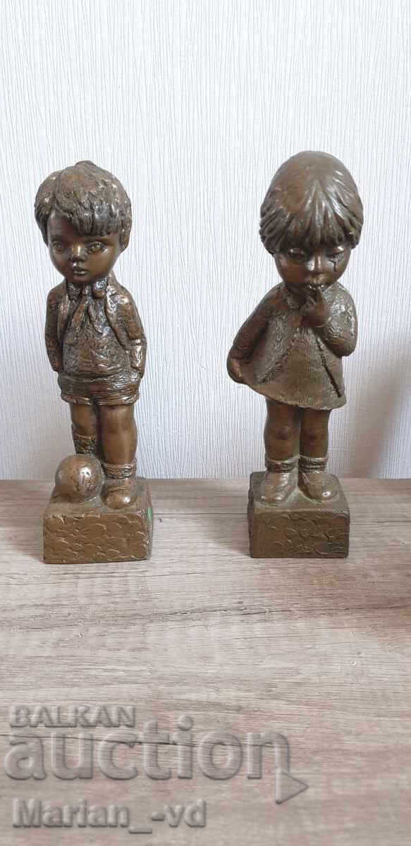 Bronze resin sculptures of a little girl and boy Bronze resin sculptures of a little girl and boy