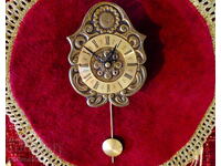 Bronze wall clock with pendulum, jewel